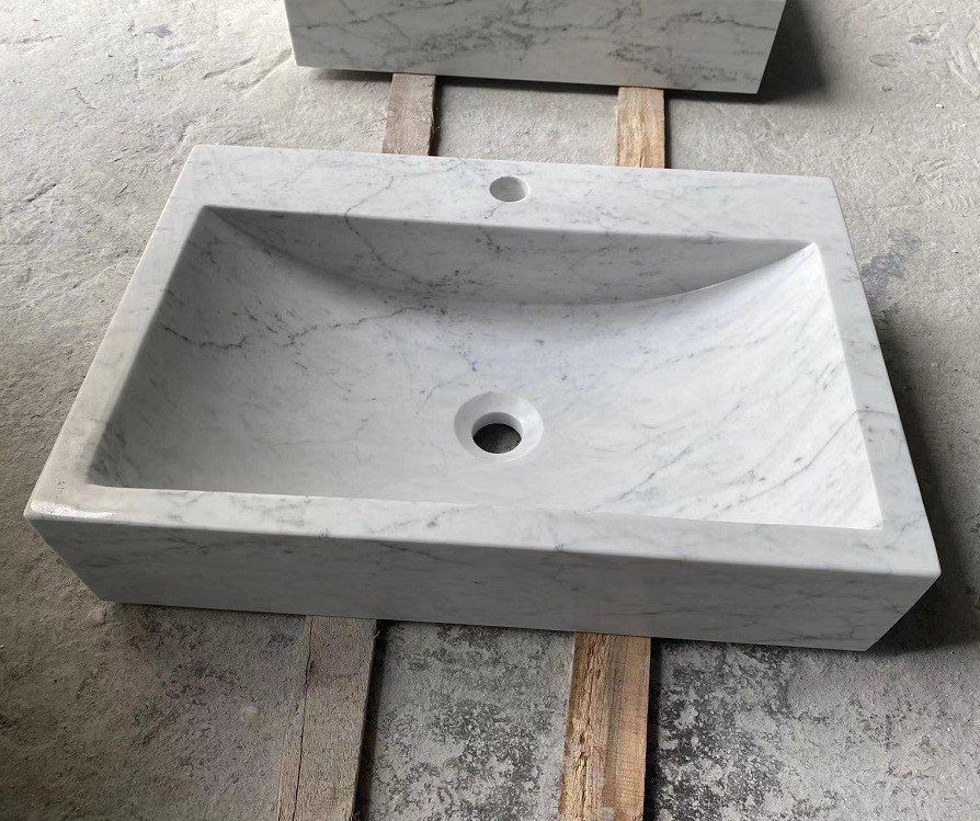 White marble sinks with different shapes White marble sinks with different shapes